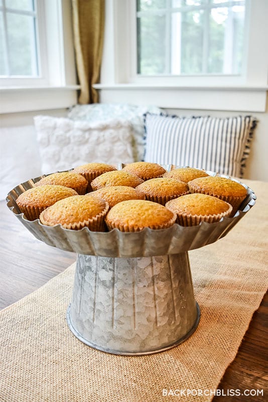 Pumpkin muffins on a galvanized pedestal.