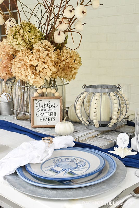 table using Mary Hadley stoneware, classic blues, pumpkins